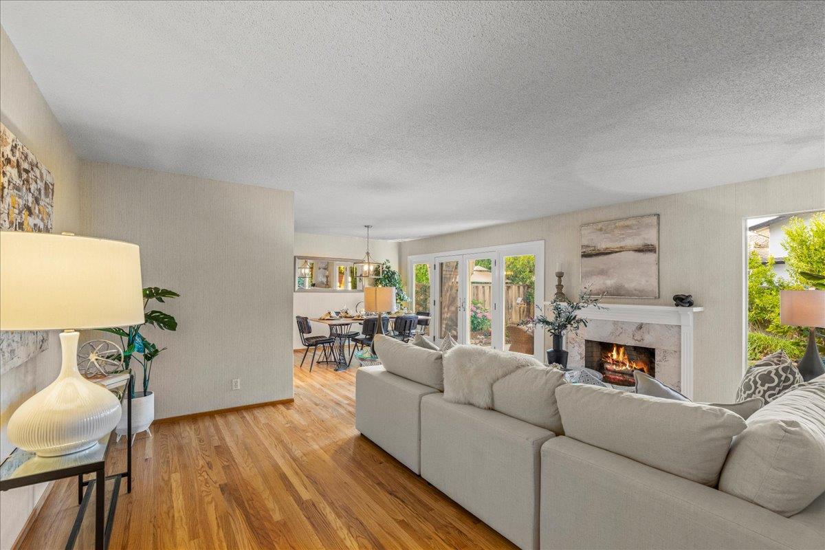 877 West Knickerbocker Drive Sunnyvale, CA 94087 - Photo 19 of 51 a living room with furniture and a fireplace