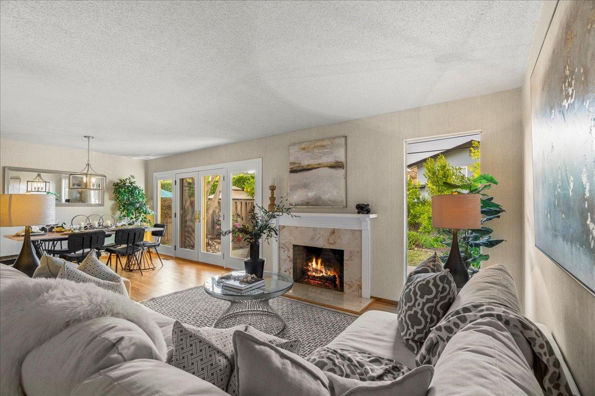 877 West Knickerbocker Drive Sunnyvale, CA 94087 - Photo 20 of 51 a living room with furniture fireplace and potted plants
