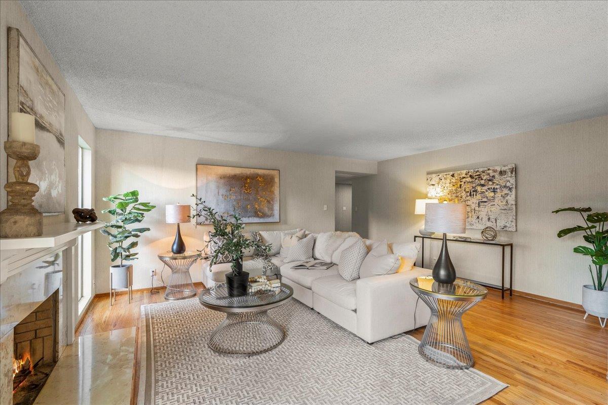 877 West Knickerbocker Drive Sunnyvale, CA 94087 - Photo 21 of 51 a living room with furniture and a fireplace