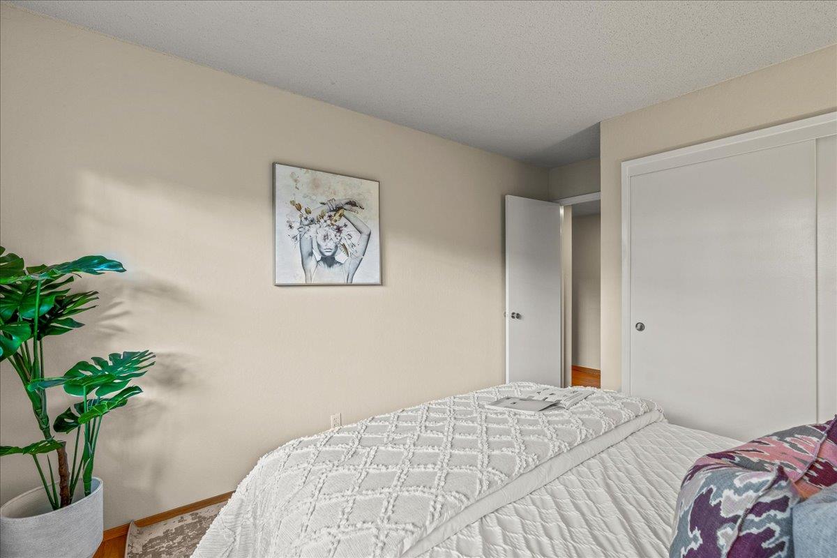 877 West Knickerbocker Drive Sunnyvale, CA 94087 - Photo 25 of 51 a bedroom with a bed and a potted plant