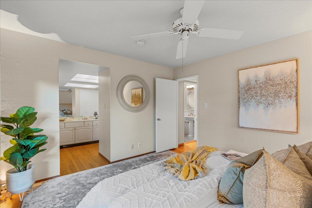 877 West Knickerbocker Drive Sunnyvale, CA 94087 - Photo 30 of 51 a bedroom with a bed and a chandelier