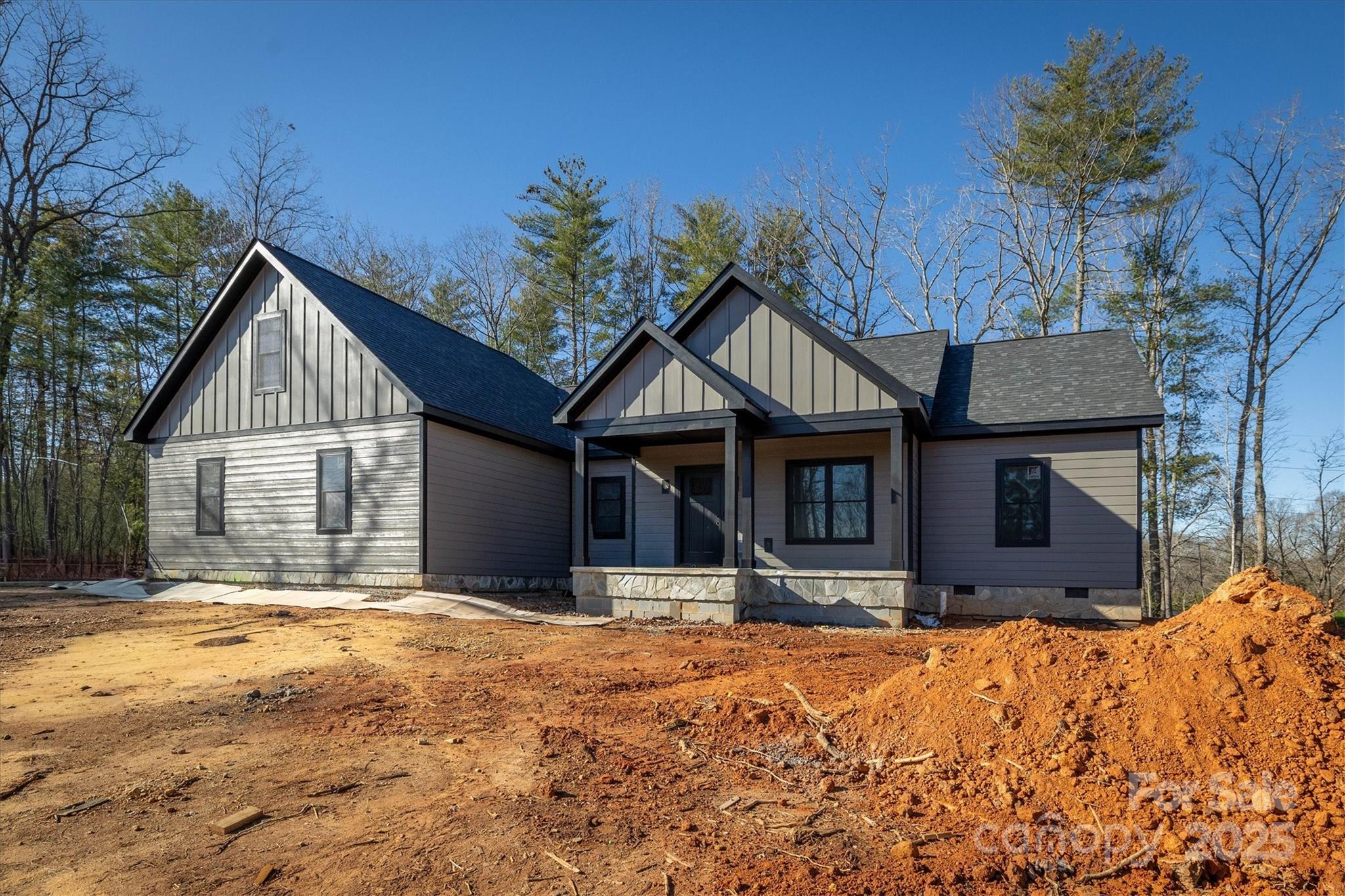 1053 Faith Court Morganton, NC 28655 - Photo 2 of 6 a front view of a house with a yard covered with snow