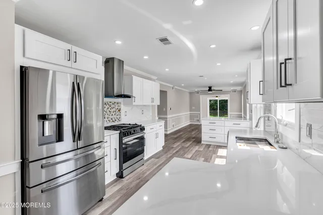 a view of room with window and wooden floor