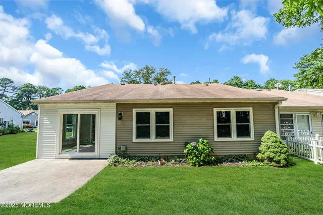 a view of a yard with swimming pool