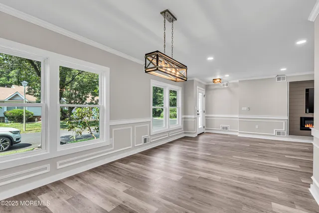 a kitchen with kitchen island granite countertop a sink stainless steel appliances and cabinets