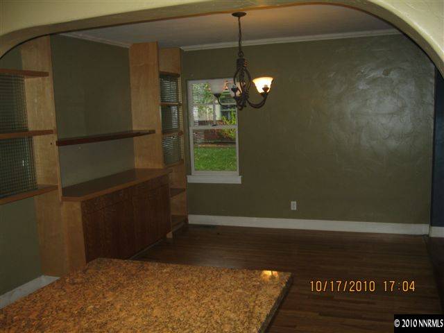 825 La Rue Avenue Reno, NV 89509 - Photo 6 of 13 a view of a room with a hanging light and hardwood