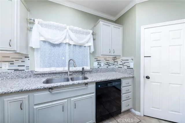 a kitchen with stainless steel appliances granite countertop a refrigerator and microwave