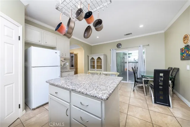 a spacious bedroom with a bed and a stove