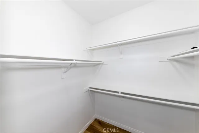 a bathroom with a granite countertop sink a mirror and a shower