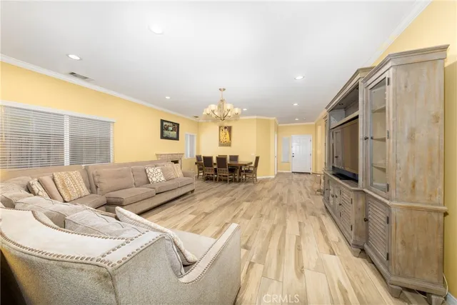a kitchen with a sink dining table and chairs