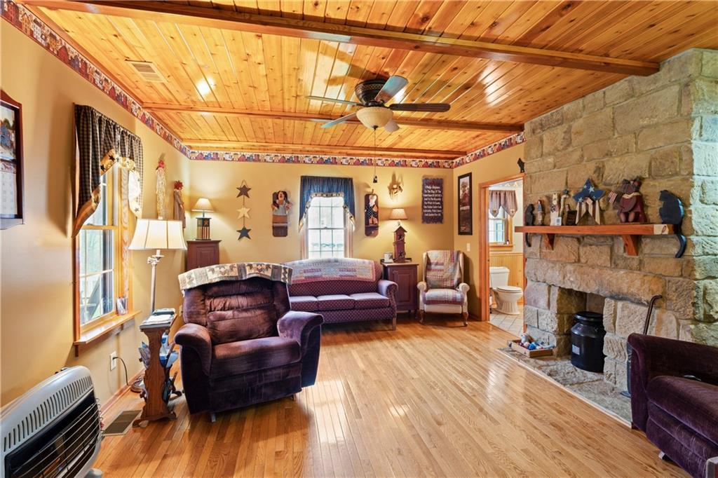 298 Lough Road Wind Ridge, PA 15380 - Photo 10 of 25 a living room with furniture and a fireplace