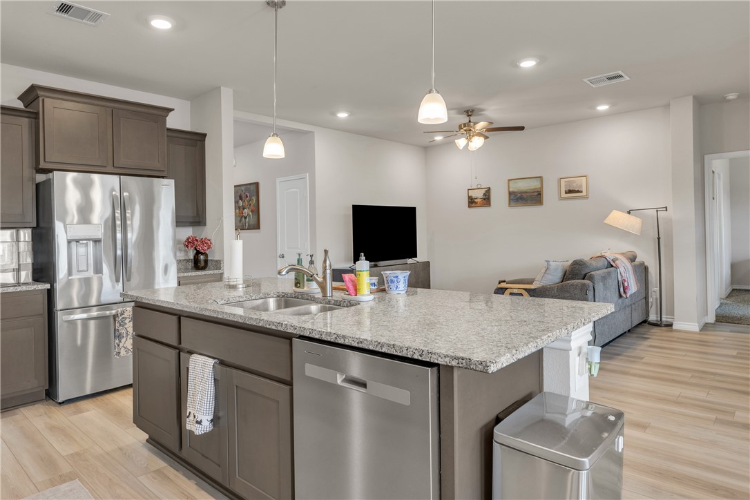 2016 Chief Street Bryan, TX 77807 - Photo 15 of 30 a kitchen with stainless steel appliances granite countertop a sink a stove and a refrigerator
