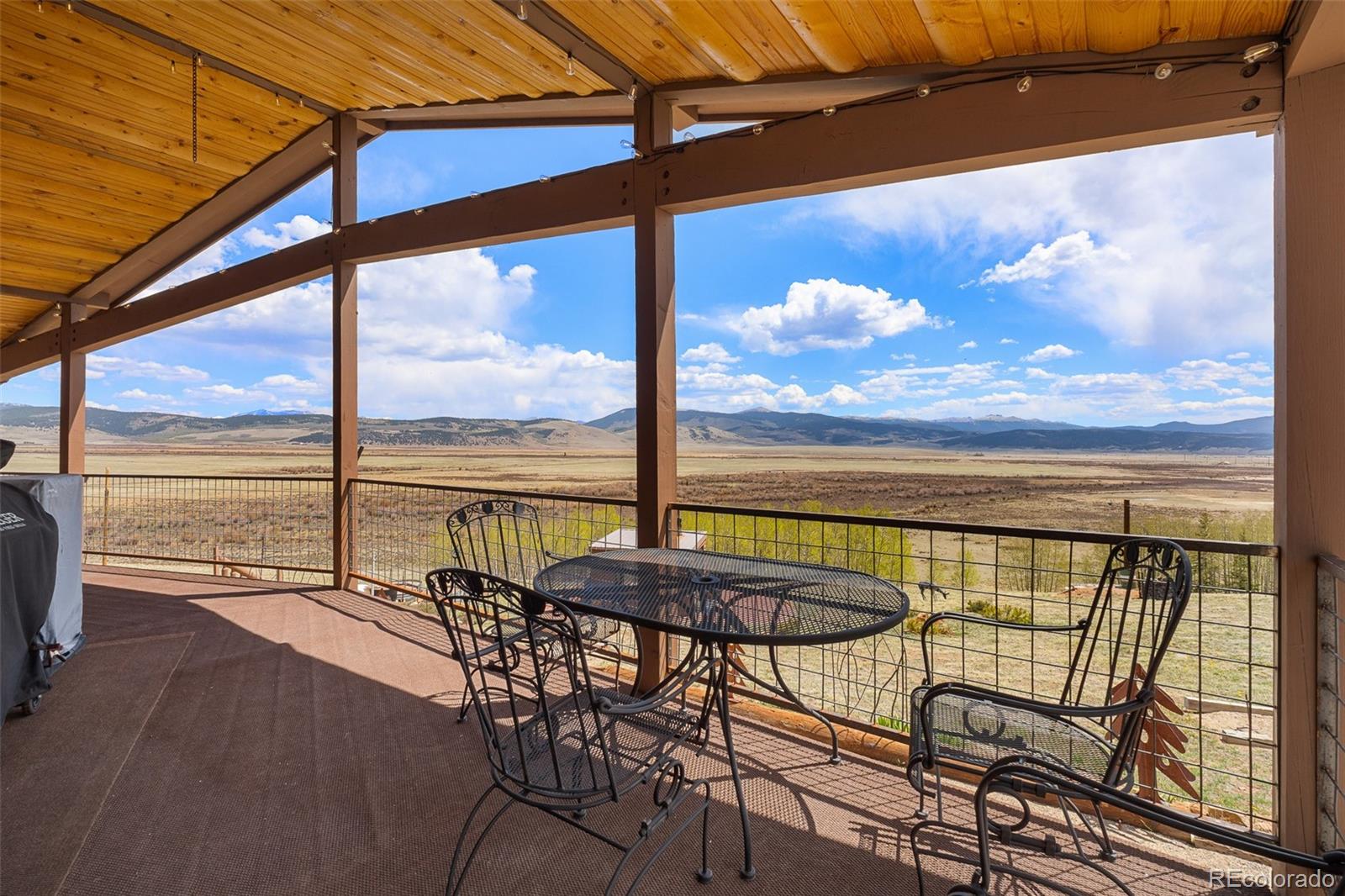1163 Michigan Hill Road Jefferson, CO 80456 - Photo 25 of 48 a view of a balcony with lake view and a ocean view