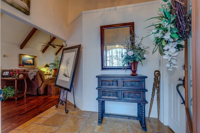 a view of a livingroom with furniture and a fireplace
