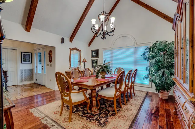 a kitchen with stainless steel appliances granite countertop a sink and a refrigerator
