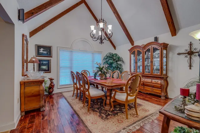 a kitchen with stainless steel appliances granite countertop a refrigerator a stove and a sink