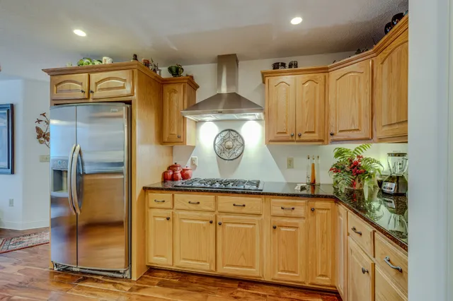 a bedroom with furniture and a chandelier