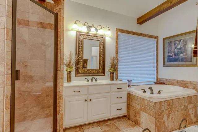 a view of walk in closet with clothes