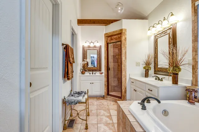 a bathroom with a sink vanity and a mirror