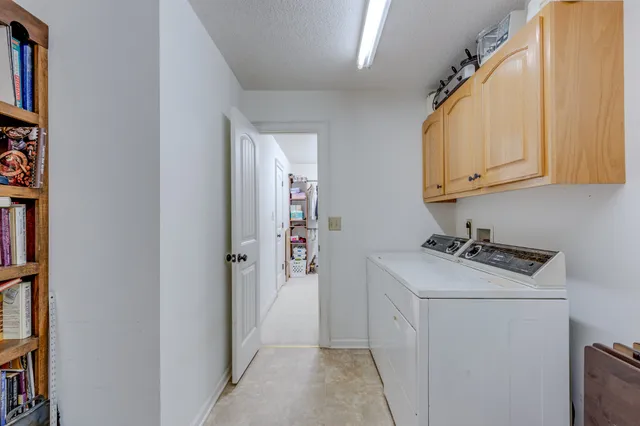 a bedroom with a bed and a potted plant