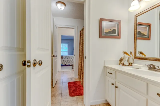 a bedroom with furniture and a chandelier