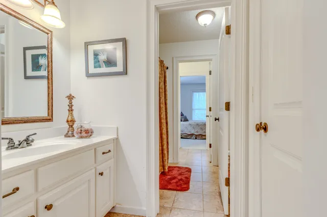 a living room with furniture a flat screen tv and gym equipment
