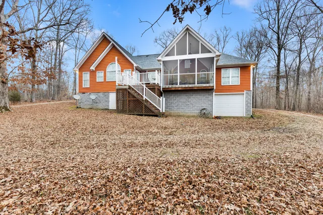 a building outdoor space with patio furniture and a potted plant
