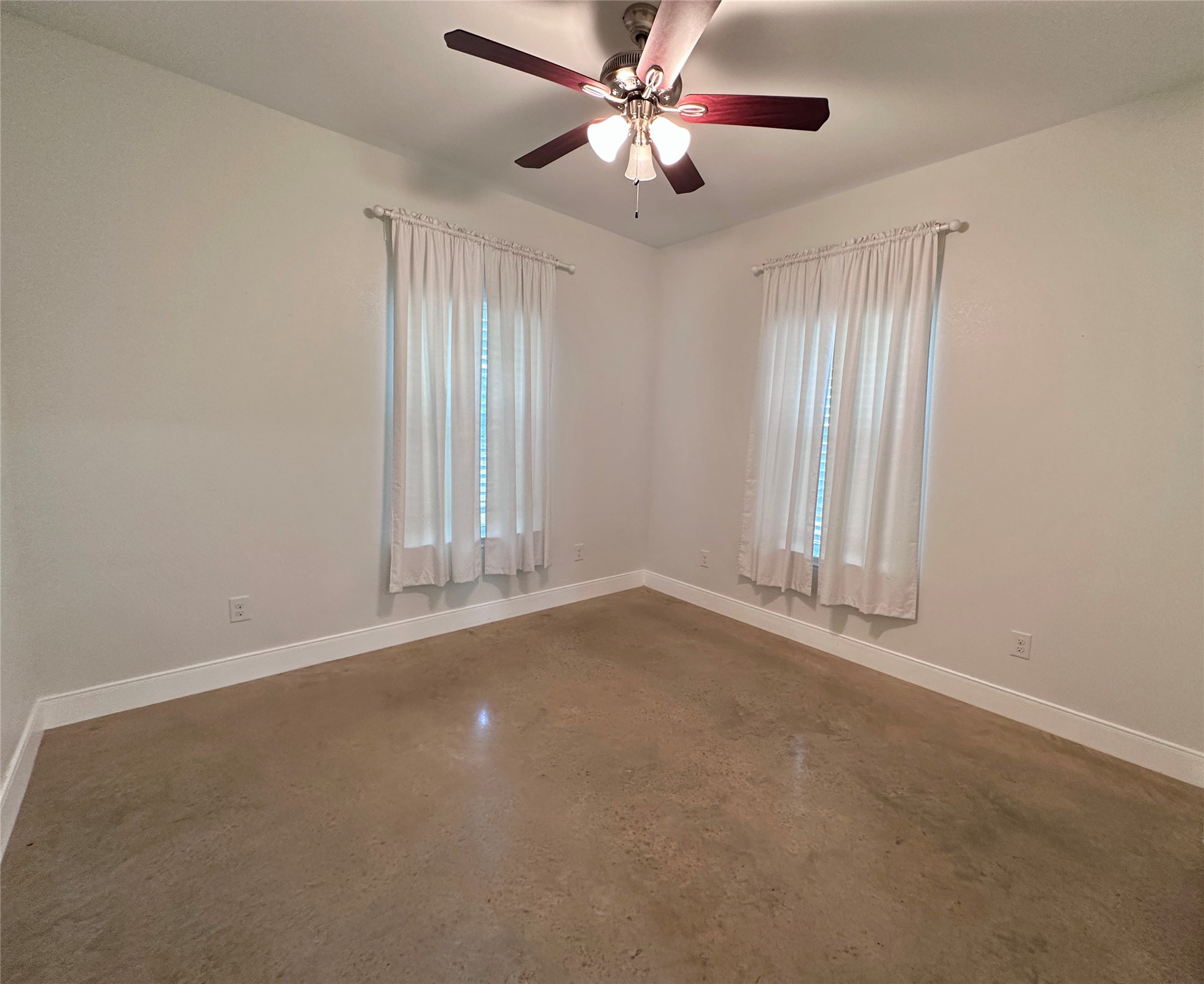 124 Pine Path Bastrop, TX 78602 - Photo 15 of 31 Bedroom with concrete flooring, ceiling fan