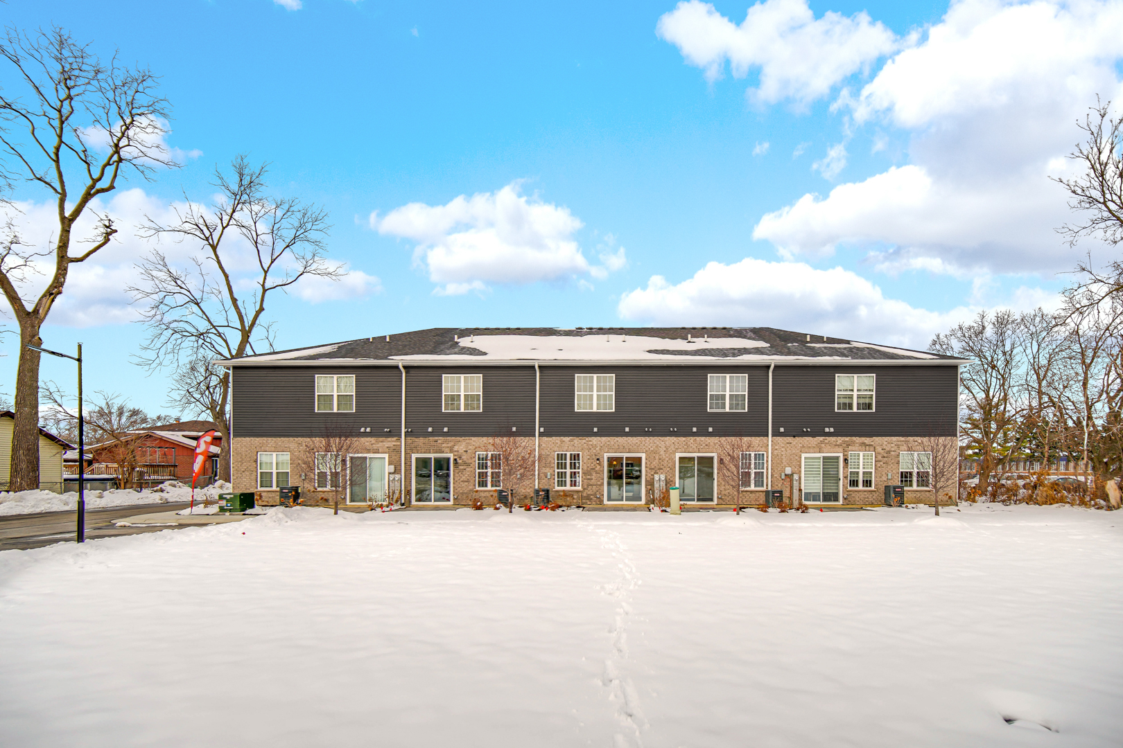 5404 135th Street Crestwood, IL 60418 - Photo 22 of 23 a front view of a house with a snow on the road