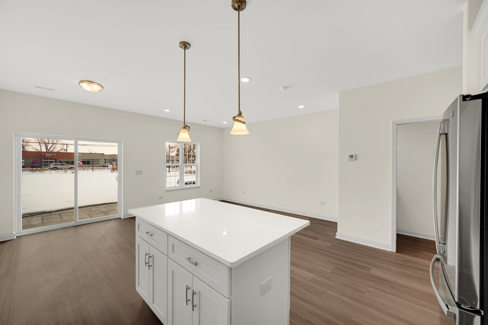 5404 135th Street Crestwood, IL 60418 - Photo 4 of 23 a kitchen with a sink a chandelier and wooden floor