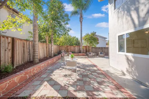 a view of a backyard with a patio