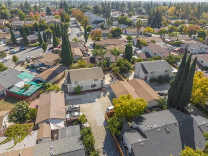 an aerial view of residential houses with outdoor space