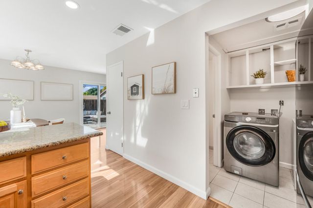 a view of a storage and utility room in a kitchen