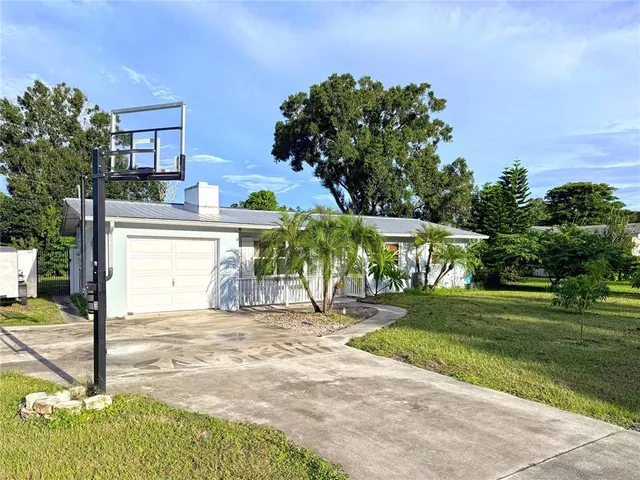 a view of a street with a building in the background