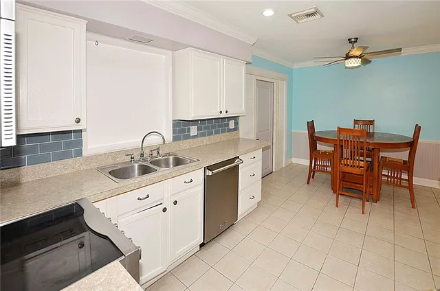 a kitchen with a sink and cabinets