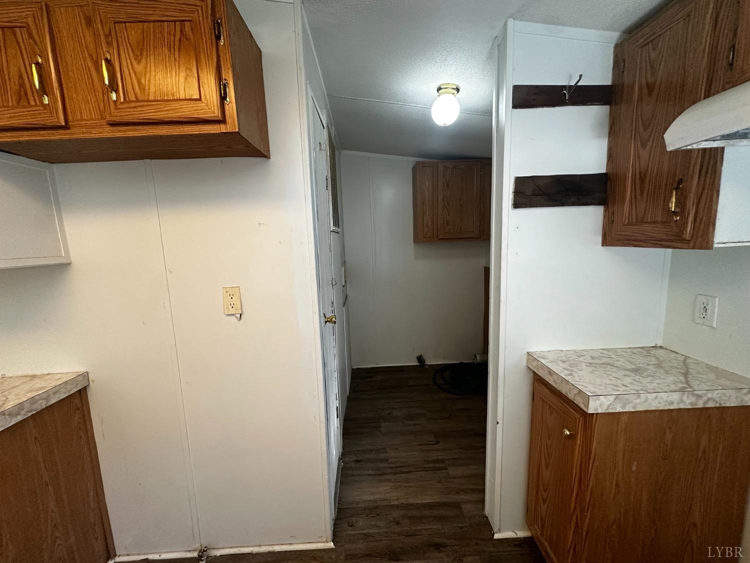 2031 Virso Road Meherrin, VA 23954 - Photo 8 of 29 a view of kitchen with utility room and wooden floor