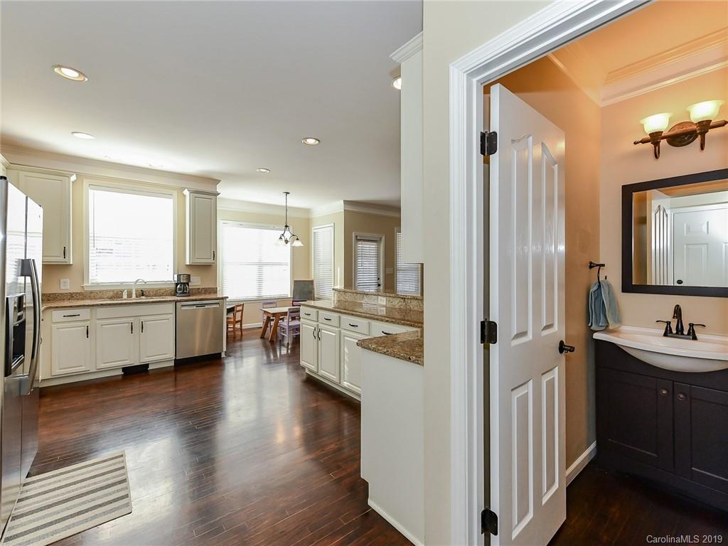 4723 Lapis Court Fort Mill, SC 29708 - Photo 13 of 36 a kitchen with a refrigerator and a sink