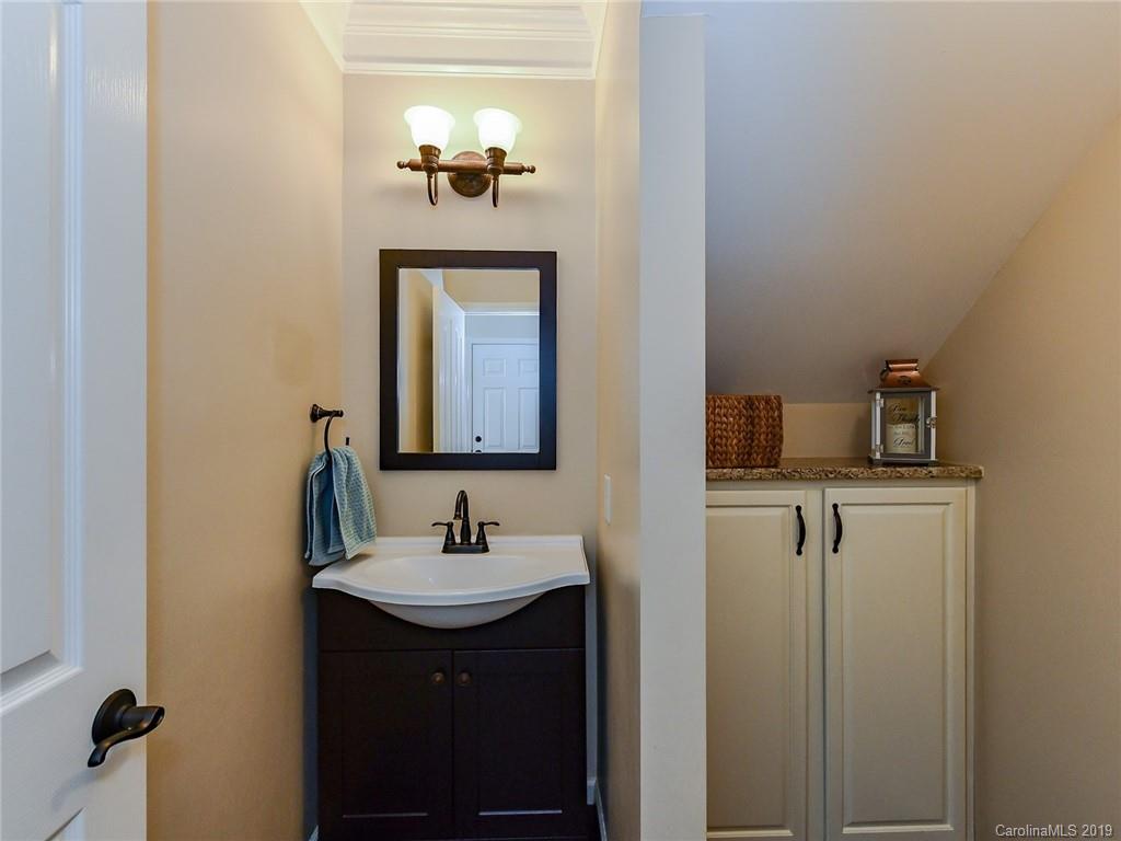 4723 Lapis Court Fort Mill, SC 29708 - Photo 14 of 36 a bathroom with a sink and a mirror