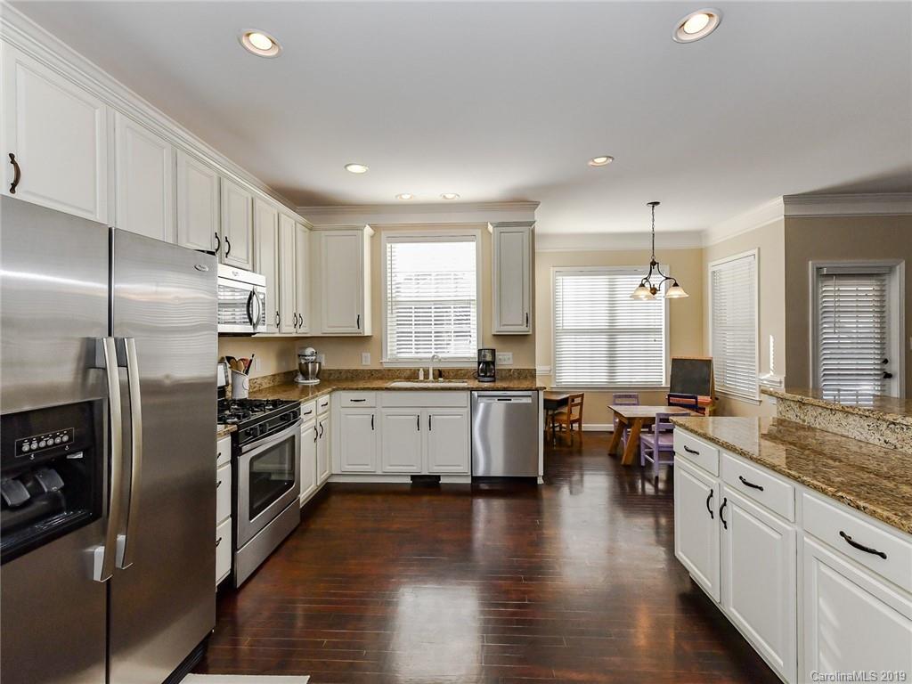 4723 Lapis Court Fort Mill, SC 29708 - Photo 15 of 36 a large kitchen with a large window and stainless steel appliances