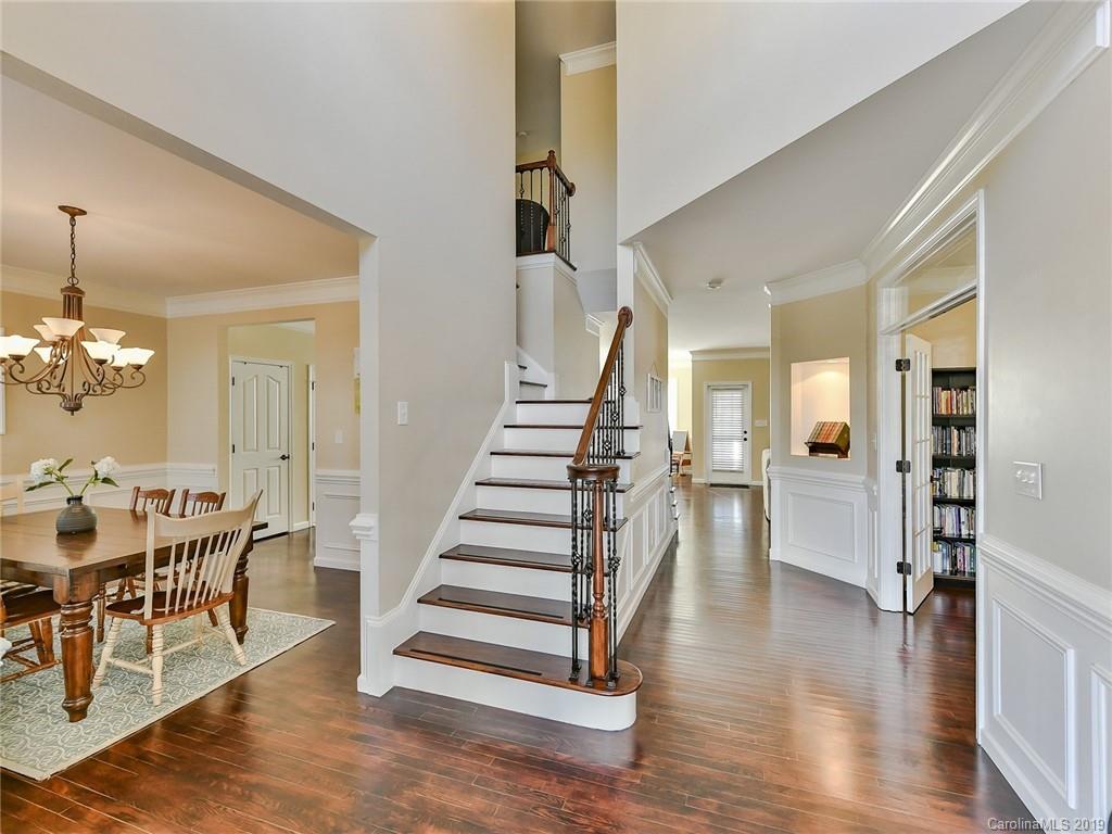 4723 Lapis Court Fort Mill, SC 29708 - Photo 3 of 36 a view of a dining room with furniture and wooden floor