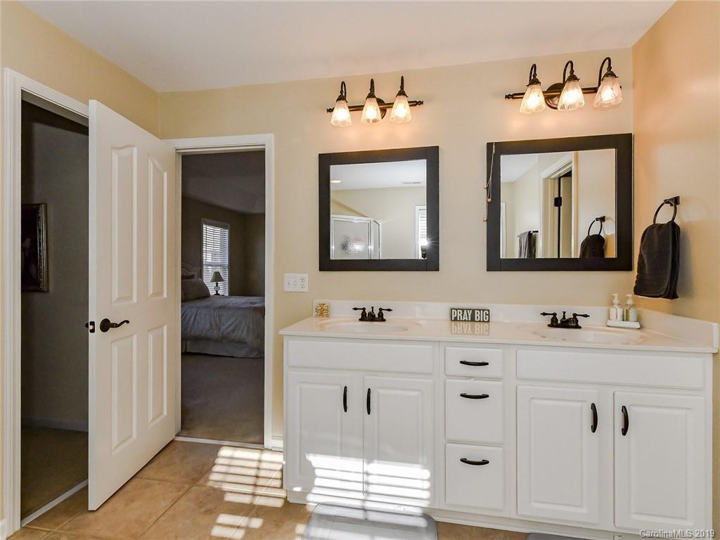 4723 Lapis Court Fort Mill, SC 29708 - Photo 21 of 36 a bathroom with a double vanity sink mirror and