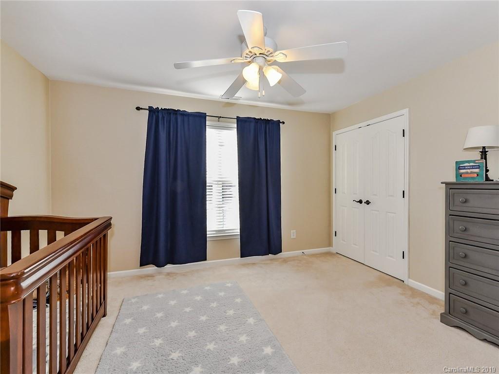 4723 Lapis Court Fort Mill, SC 29708 - Photo 22 of 36 a view of a hallway with closet and chandelier fan