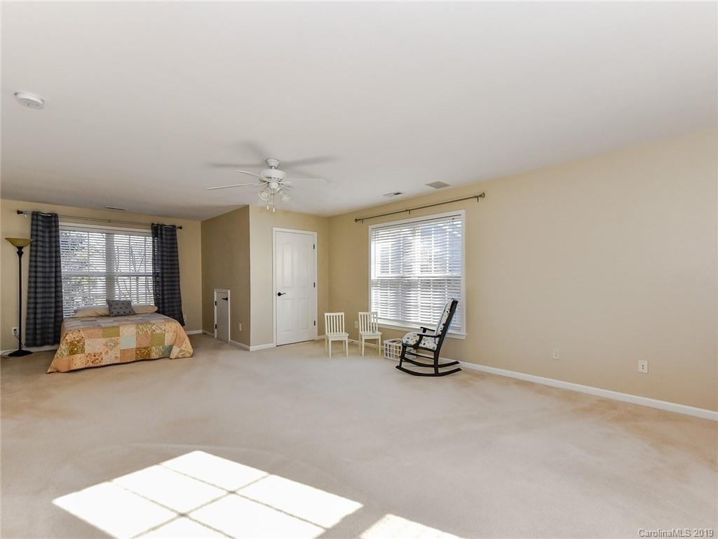 4723 Lapis Court Fort Mill, SC 29708 - Photo 23 of 36 a view of a room with gym equipment and windows