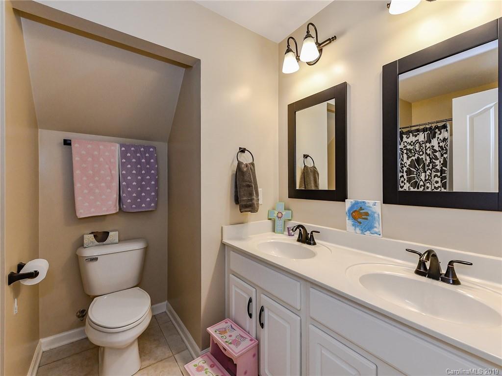 4723 Lapis Court Fort Mill, SC 29708 - Photo 25 of 36 a bathroom with a toilet sink and mirror