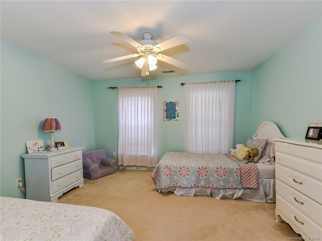 4723 Lapis Court Fort Mill, SC 29708 - Photo 26 of 36 a bedroom with a bed and window