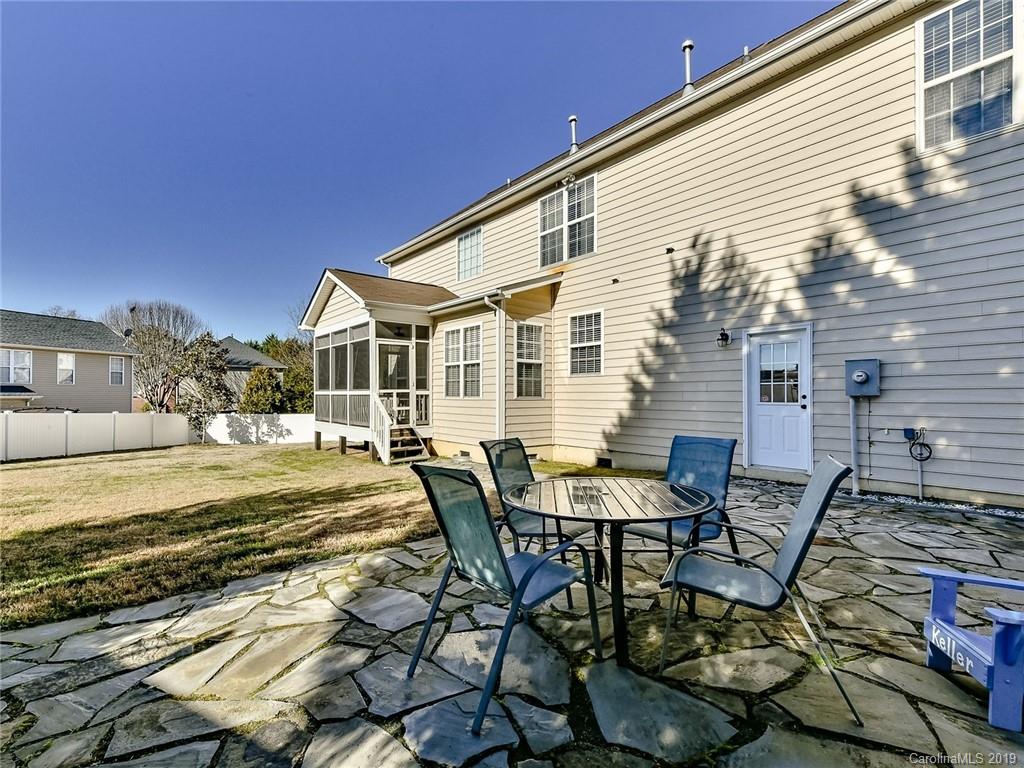 4723 Lapis Court Fort Mill, SC 29708 - Photo 29 of 36 a view of a patio with table and chairs with wooden floor and fence