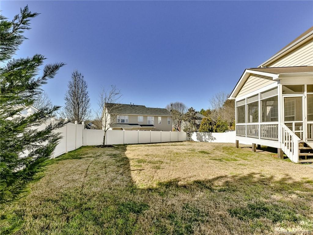 4723 Lapis Court Fort Mill, SC 29708 - Photo 31 of 36 a view of a house with a big yard and large trees