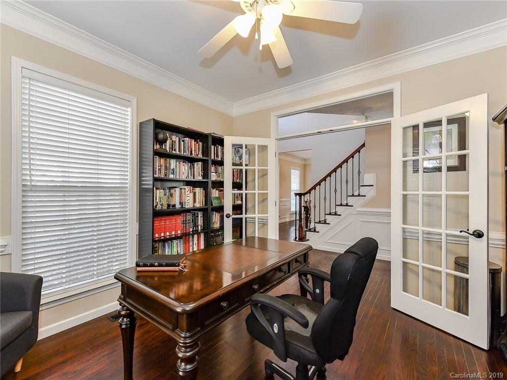 4723 Lapis Court Fort Mill, SC 29708 - Photo 5 of 36 a living room with furniture a table and a bookshelf