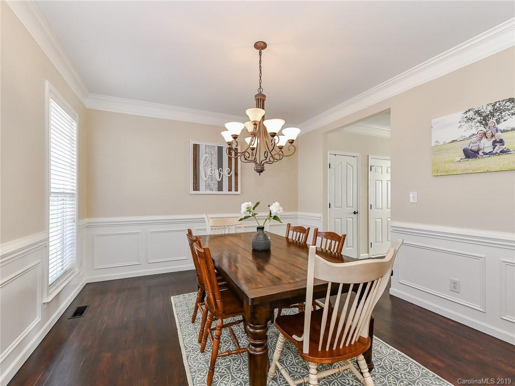 4723 Lapis Court Fort Mill, SC 29708 - Photo 6 of 36 a view of a dining room with furniture window and wooden floor