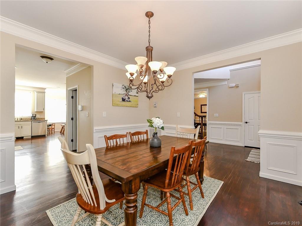 4723 Lapis Court Fort Mill, SC 29708 - Photo 7 of 36 a view of a dining room with furniture and wooden floor